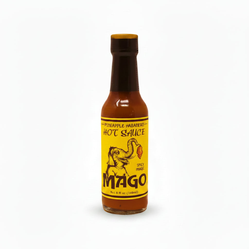 Bottle of Mago hot sauce with a yellow label on a white background
