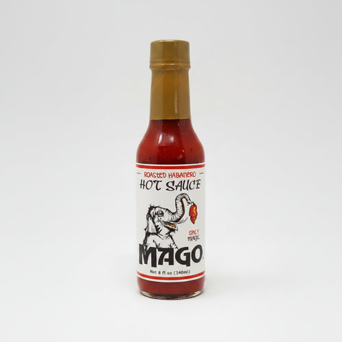Bottle of Mago hot sauce on a white background